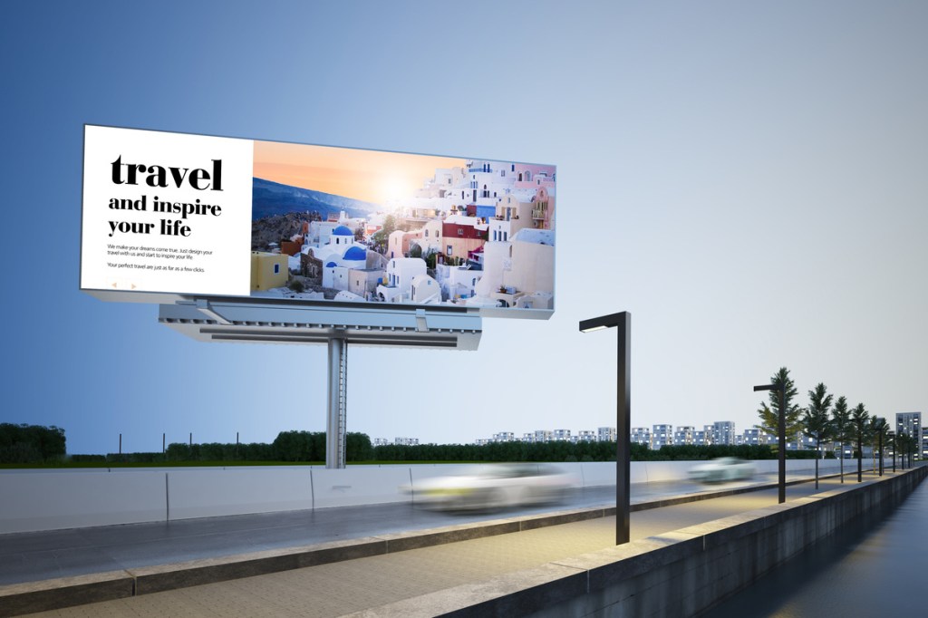 a travel advertising billboard with clear and crisp copy on a highway