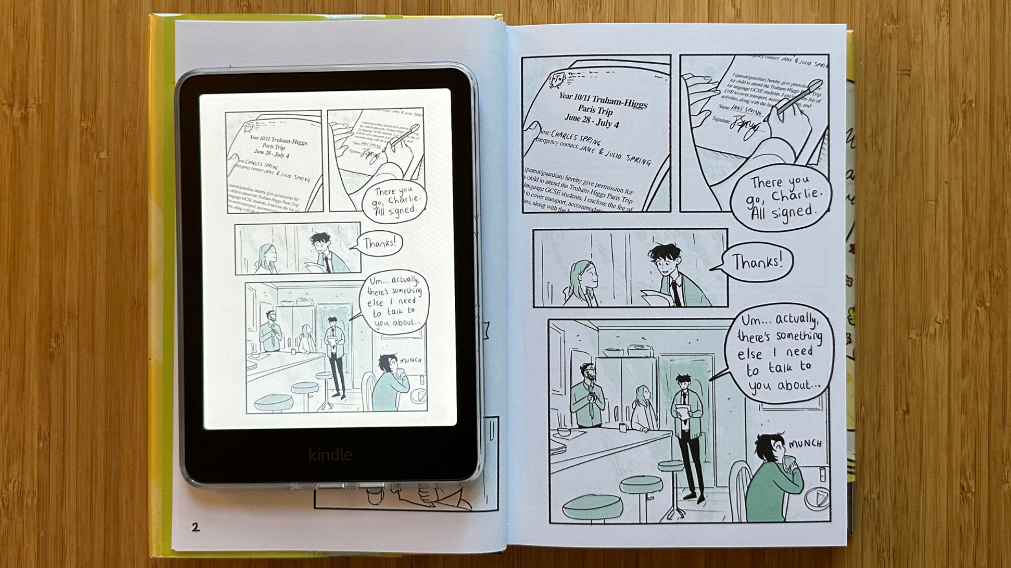 A Kindle Colorsoft laying on the left side of a Heartbreaker graphic novel.